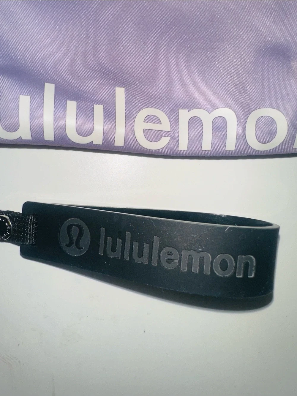 lululemon Lavender Zipper Pouch with Black Silicone Wrist Strap